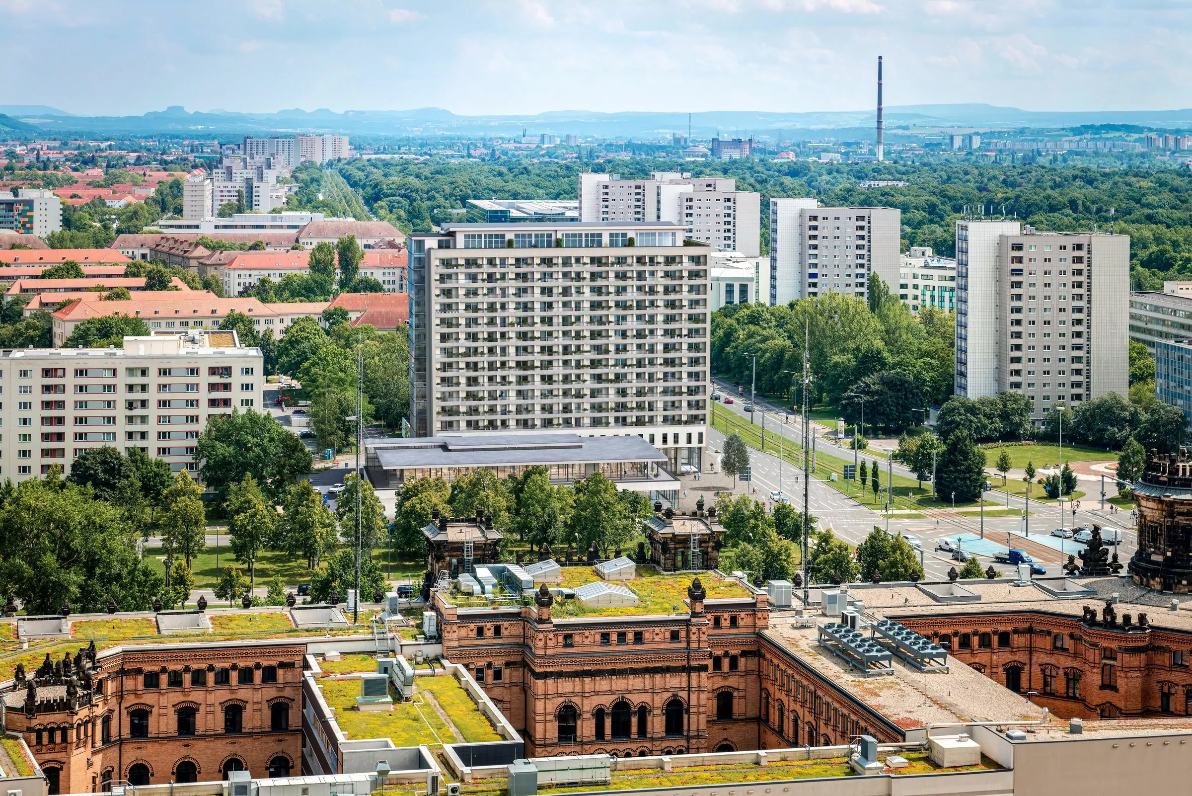 Aerial view of Dresden, looking East, with the rooftops of the building of the Police Department in the foreground and typical soviet apartment blocks in the background.